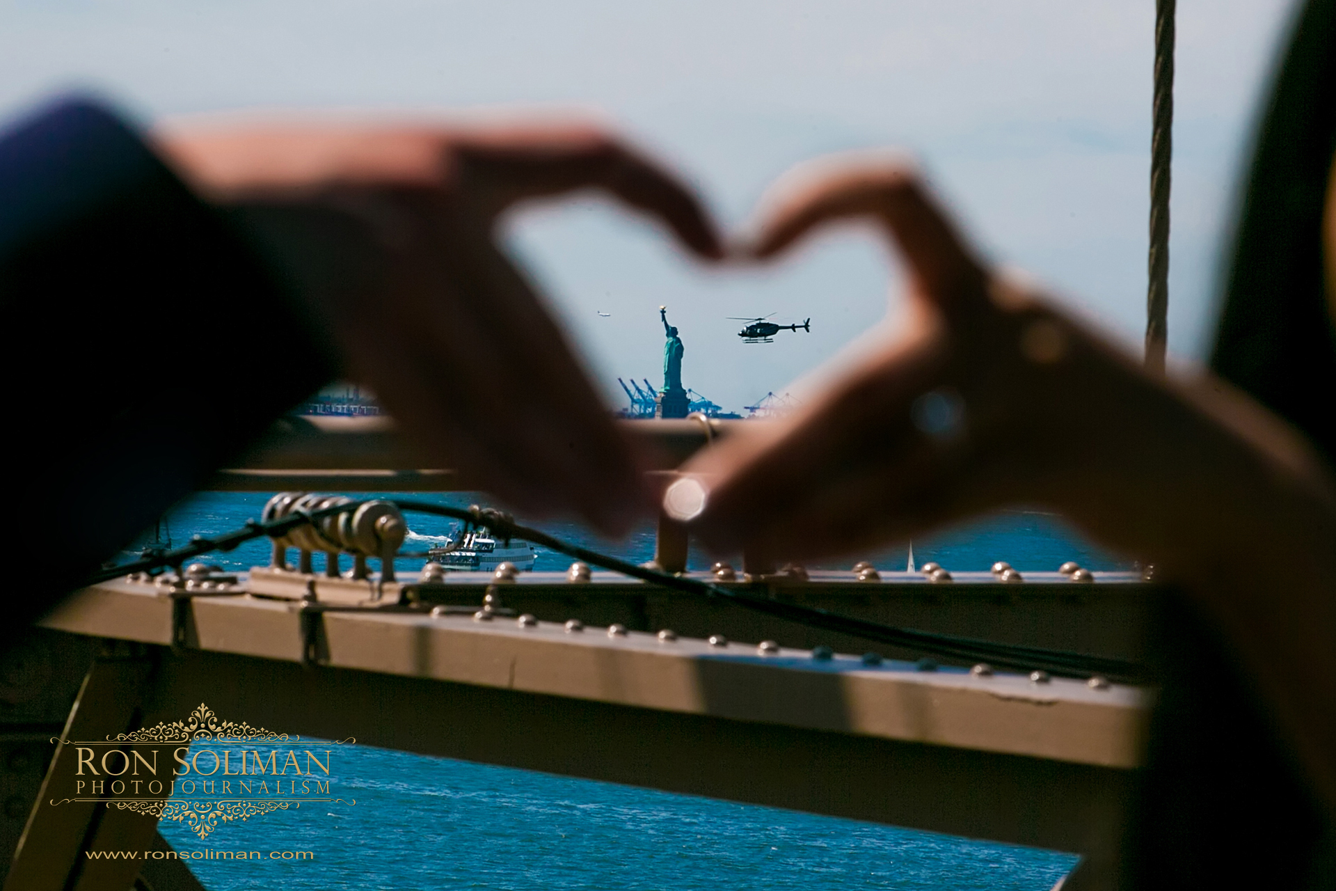 statue of liberty engagement photo