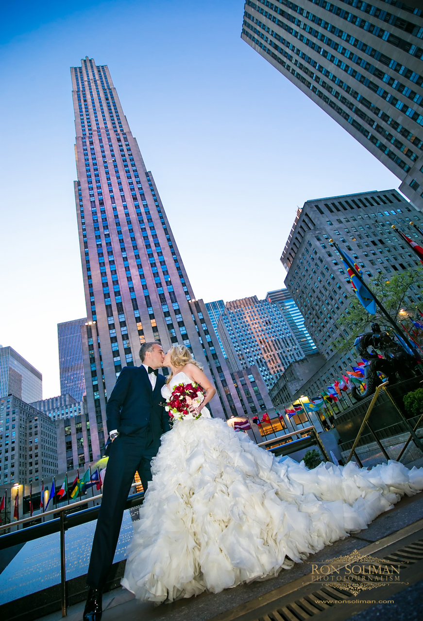 Newly Weds Sweet Kiss at The Rockefeller Center |  Rainbow Room New York Wedding Noel + Rob