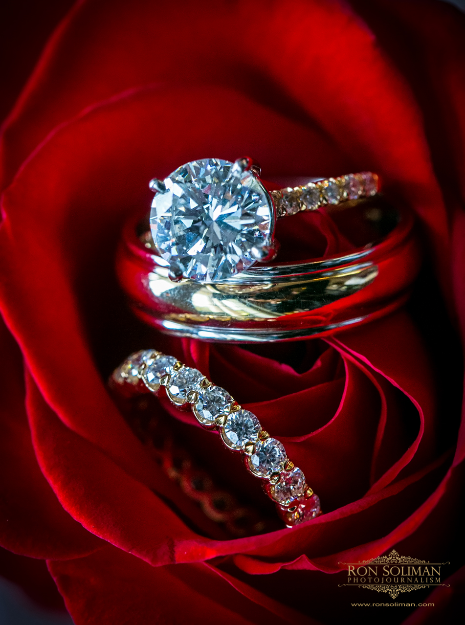 Elegant Diamond Gold Engagement Ring and Wedding Bands on a Rose | Rainbow Room New York Wedding Noel + Rob